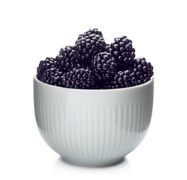 Photo of Ceramic bowl of tasty ripe blackberries on white background