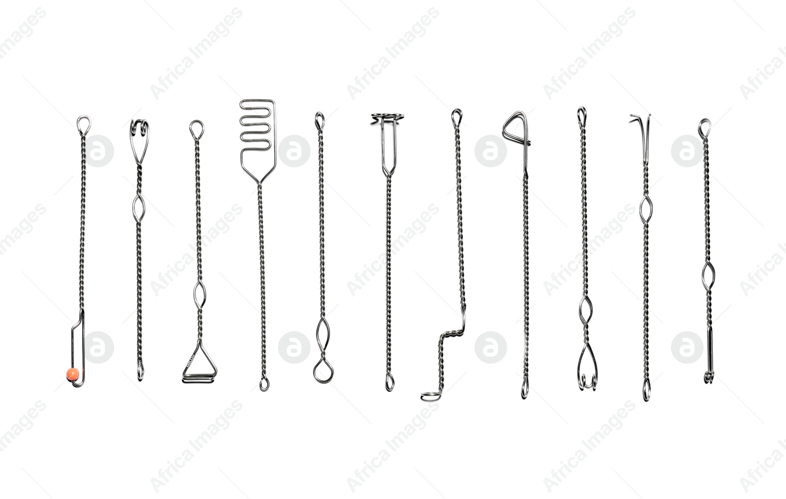 Photo of Set of logopedic probes on white background, top view. Speech therapist's tools