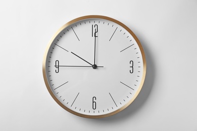 Photo of Modern clock on white background. Time management