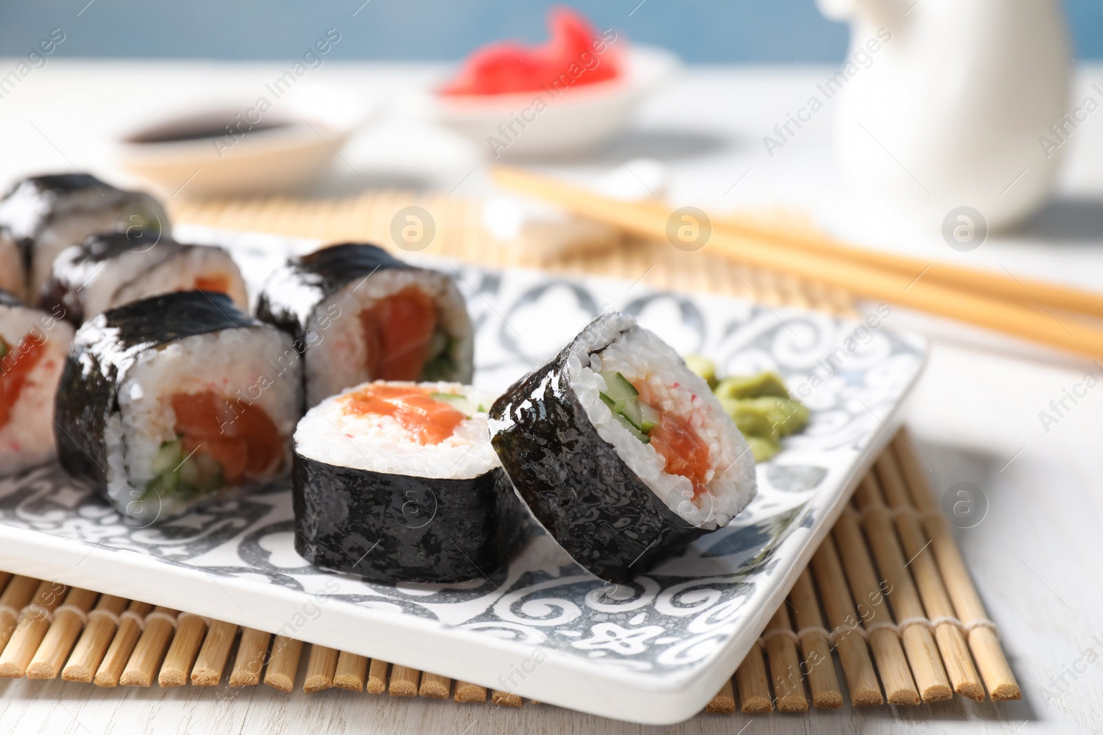 Photo of Tasty sushi rolls with wasabi served on table, closeup