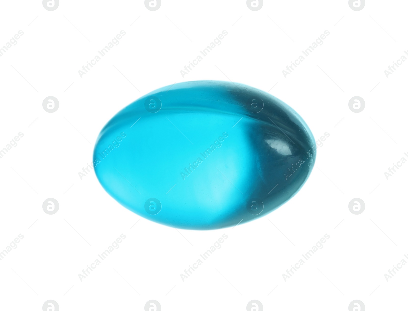 Photo of One light blue pill on white background. Medicinal treatment