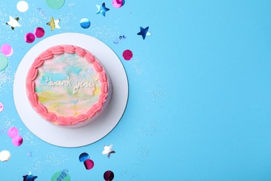 Cute bento cake with tasty cream and confetti on light blue background, flat lay. Space for text