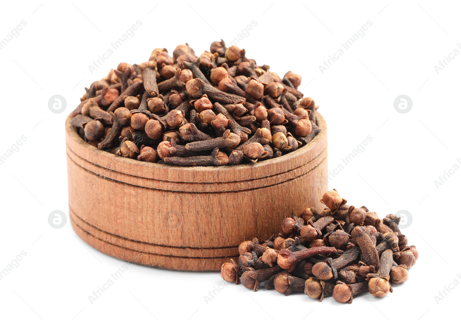 Photo of Aromatic dry cloves and wooden bowl on white background