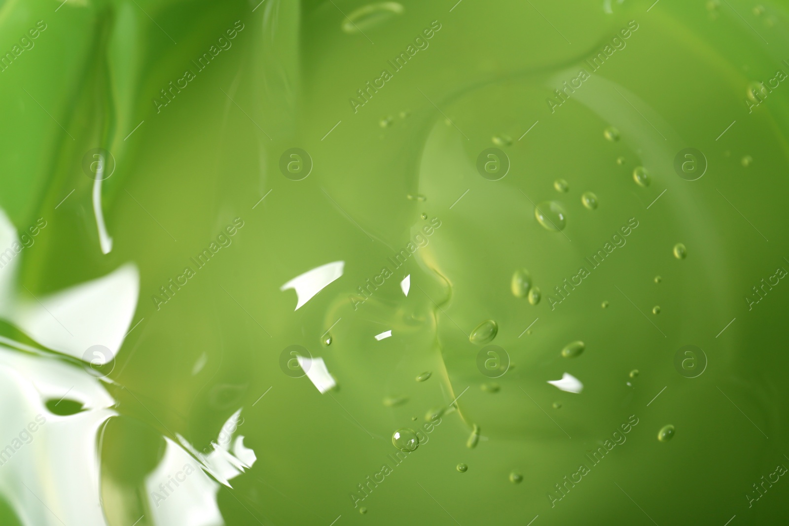 Photo of Aloe gel as background, closeup. Cosmetic product