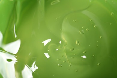 Photo of Aloe gel as background, closeup. Cosmetic product