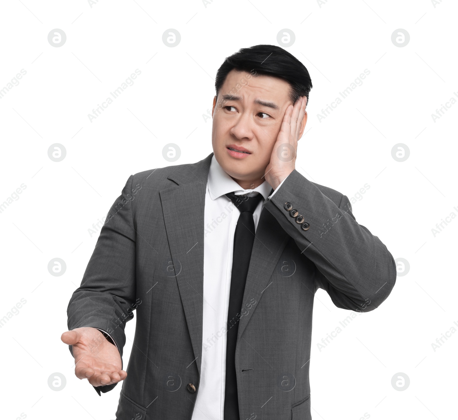 Photo of Tired businessman in suit posing on white background