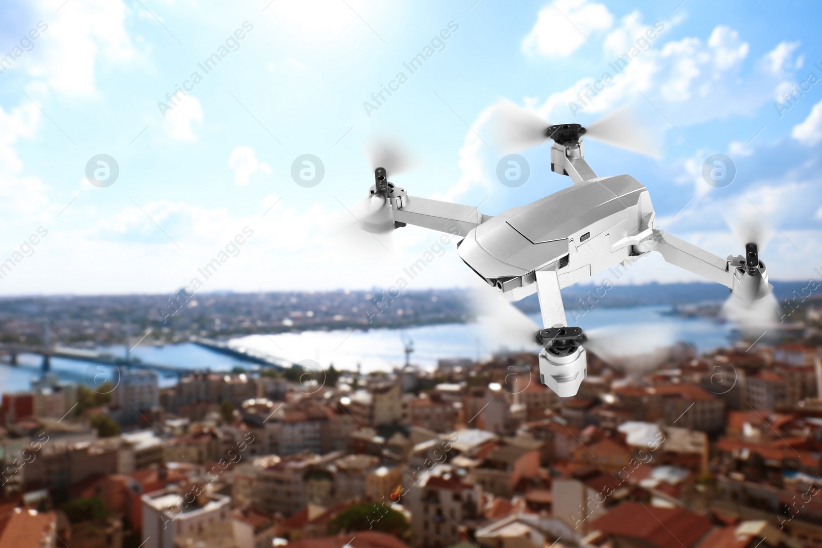 Image of Modern drone flying over city. Aerial survey