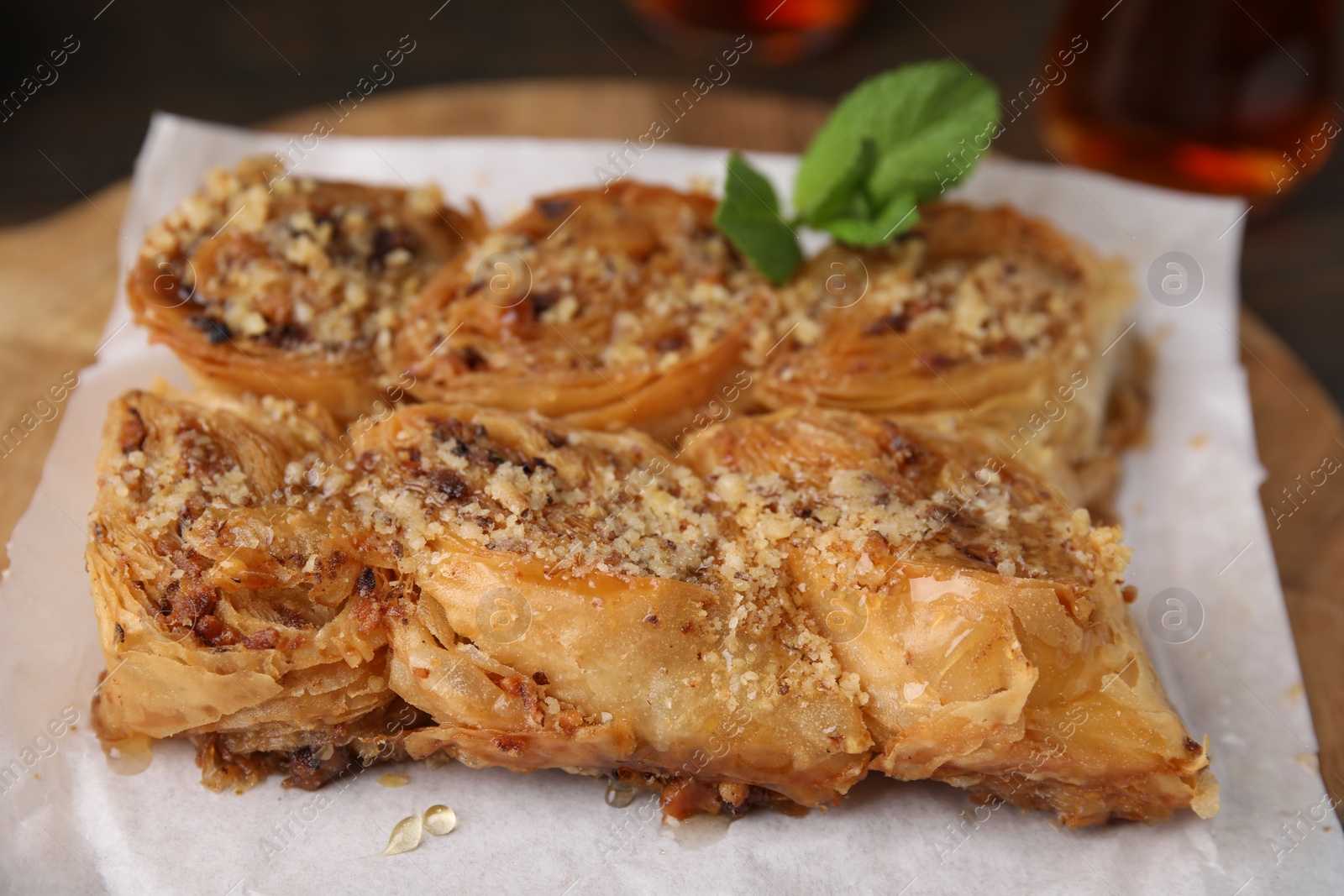 Photo of Eastern sweets. Pieces of tasty baklava on table, closeup