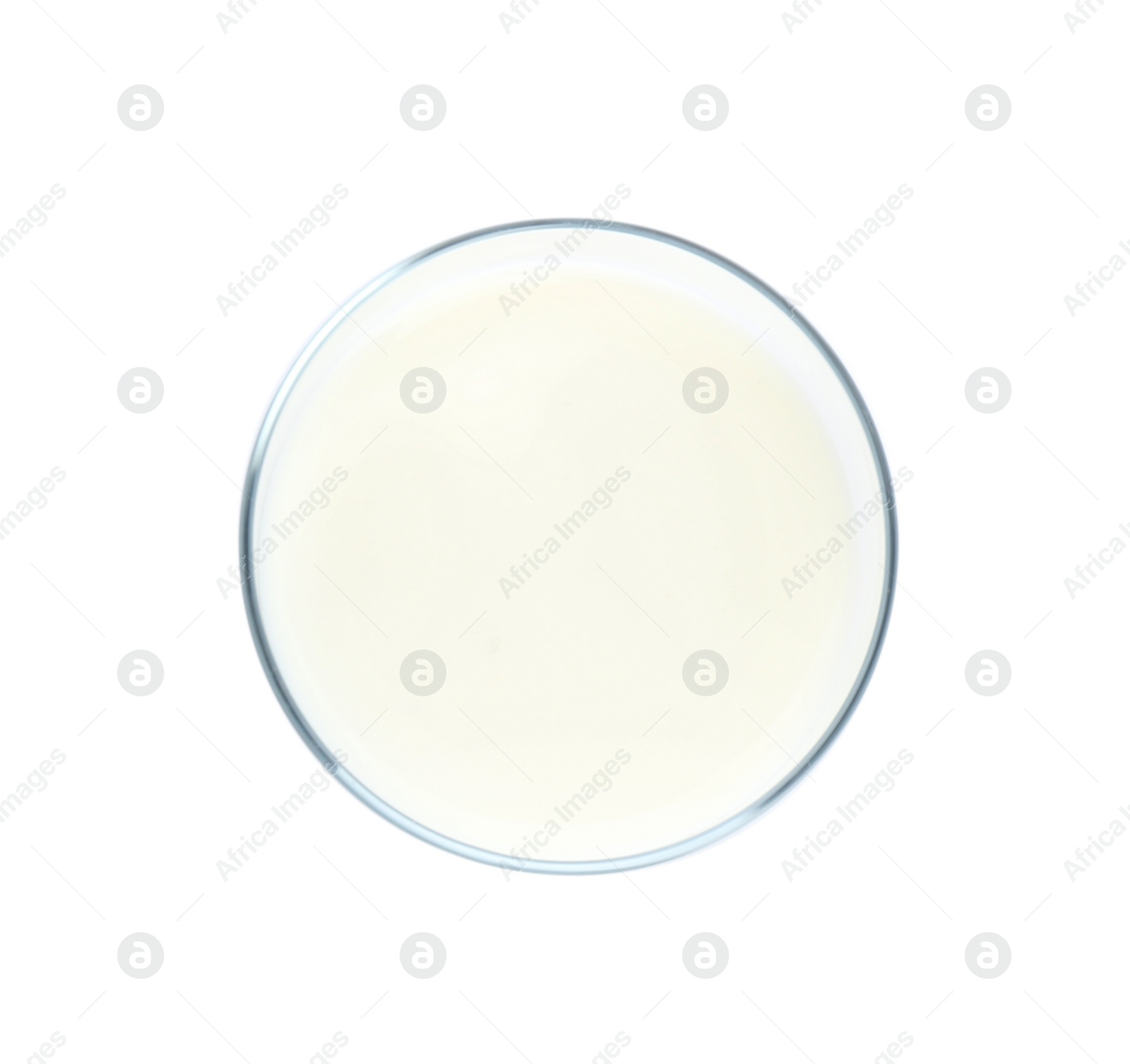 Photo of Glass with milk on white background, top view