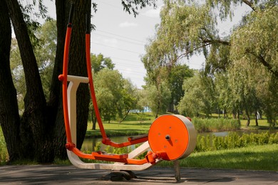 Outdoor gym with exercise machine in park