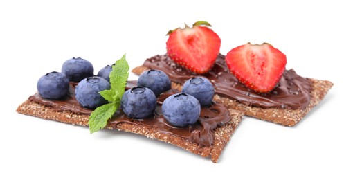 Photo of Fresh crunchy rye crispbreads with chocolate spread and sweet berries isolated on white