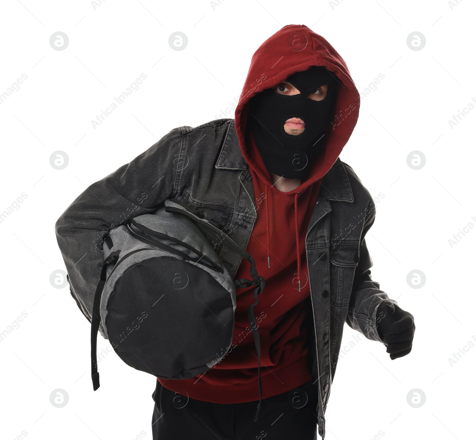 Photo of Thief in balaclava with bag on white background