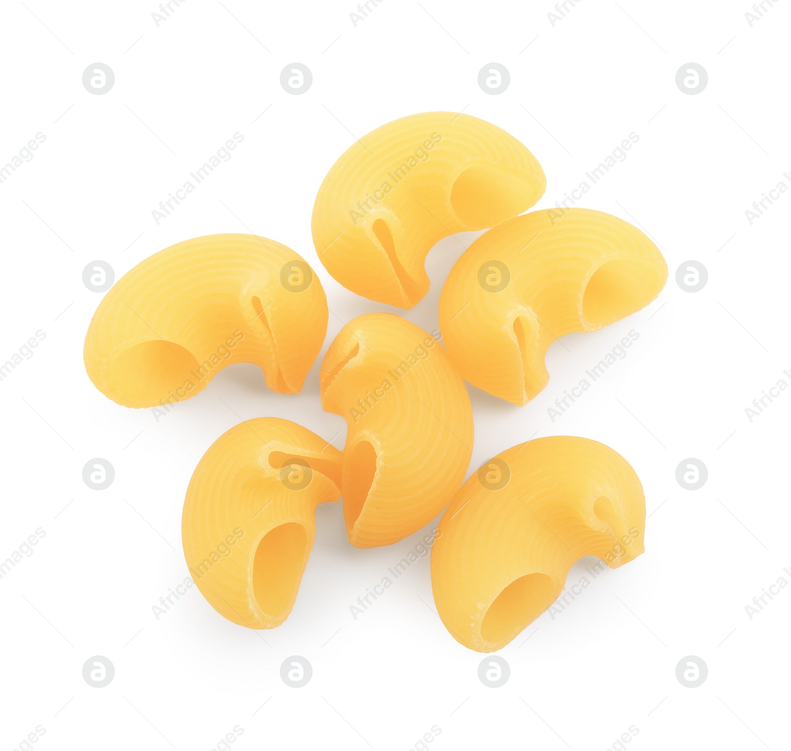 Photo of Raw horns pasta isolated on white, top view