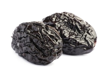 Photo of Sweet dried prunes on white background. Healthy snack