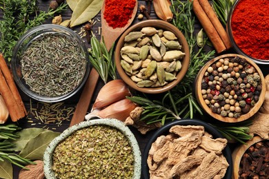 Photo of Different natural spices and herbs on table, flat lay