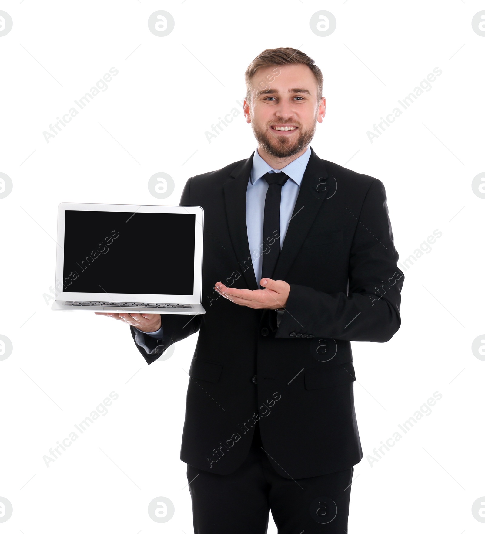 Photo of Happy young businessman holding laptop with empty screen on white background, space for text