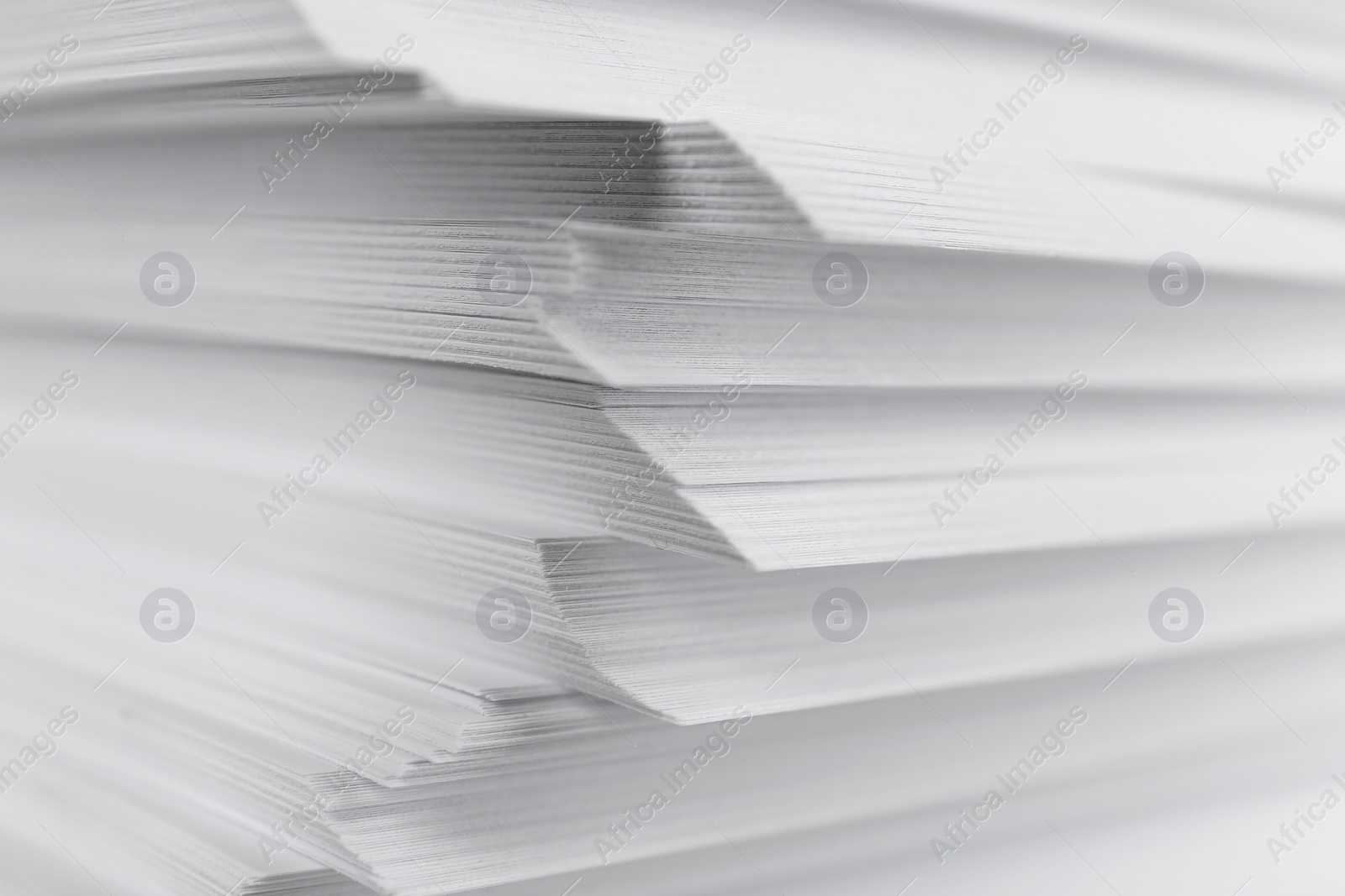 Photo of Stack of blank white paper as background, closeup