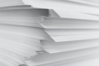 Photo of Stack of blank white paper as background, closeup