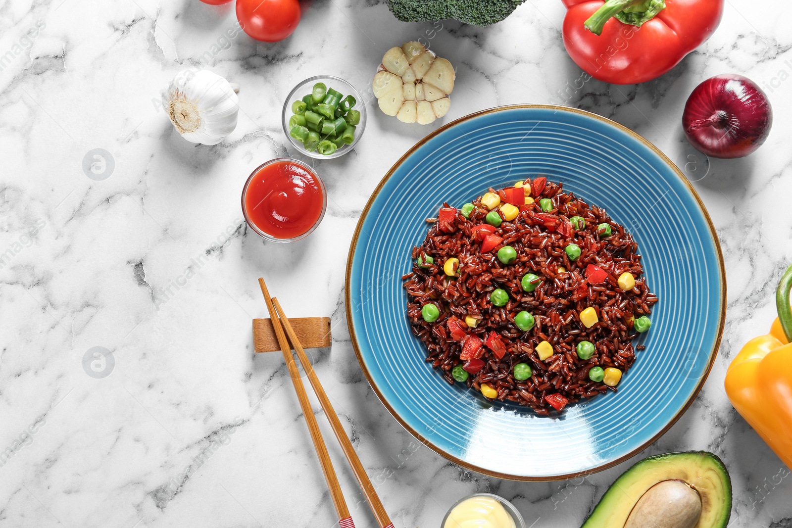 Photo of Flat lay composition with plate of boiled brown rice and space for text on table