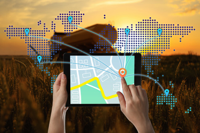 Image of Logistics concept. Woman using tablet with world map illustration against truck