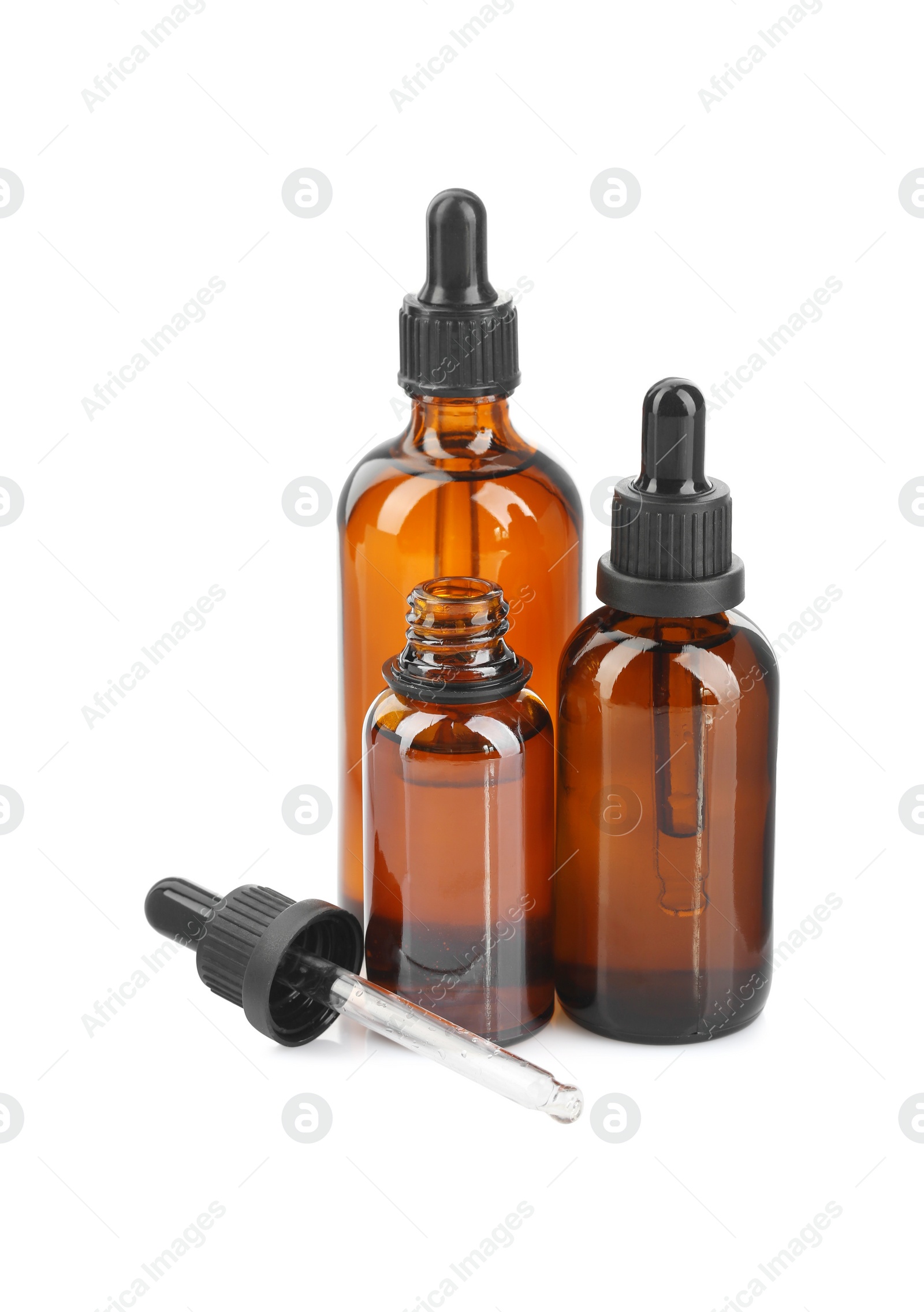 Photo of Glass bottles and pipette with tincture isolated on white