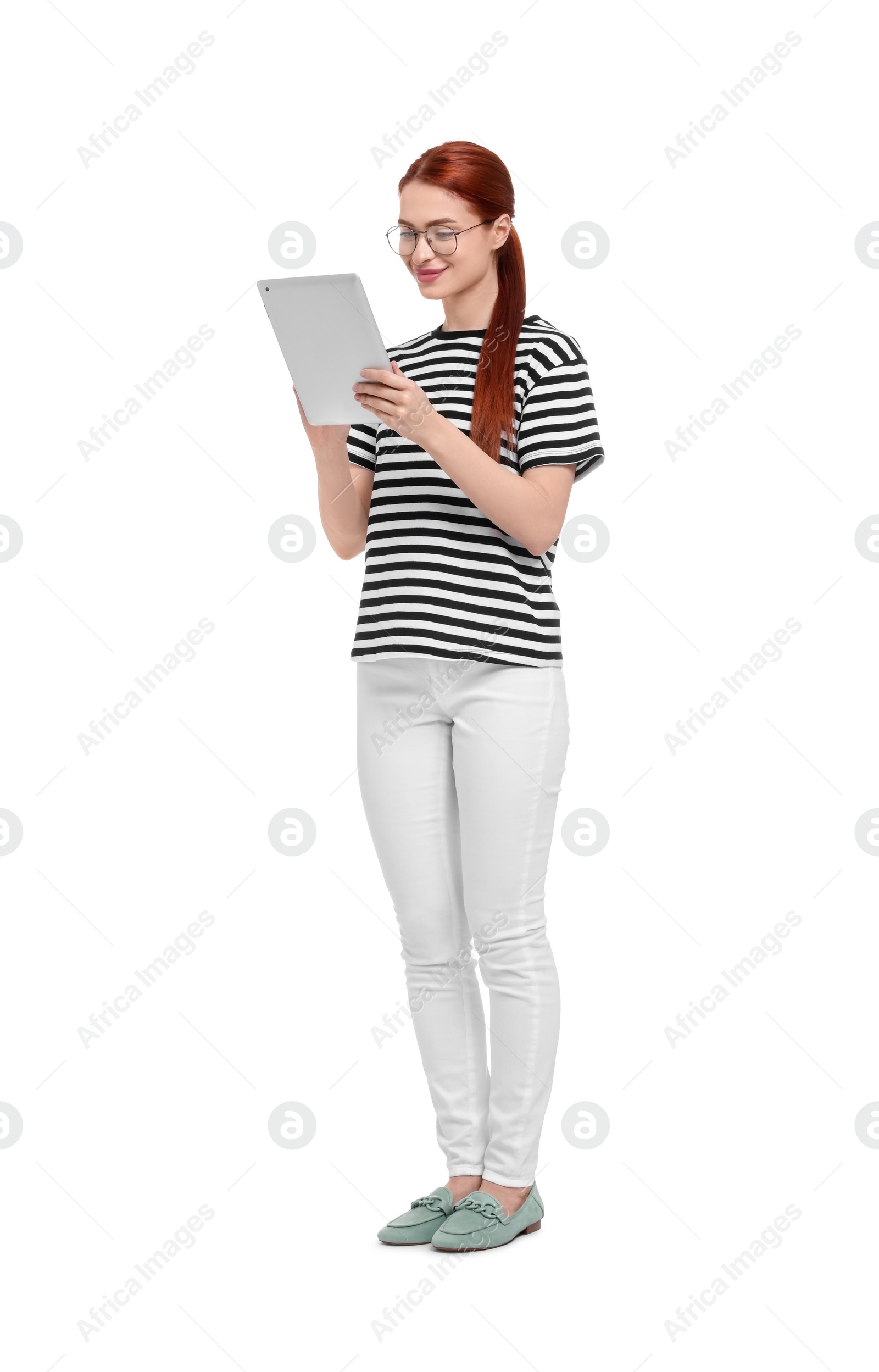 Photo of Happy woman in glasses using tablet on white background