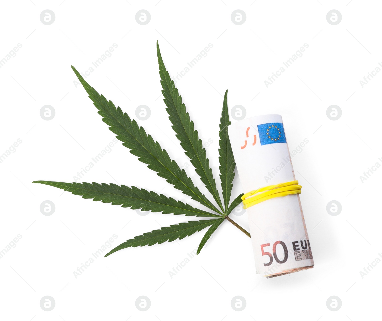 Photo of Hemp leaf and rolled money on white background, top view