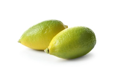 Photo of Ripe limequats on white background. Citrus fruits