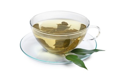 Refreshing green tea in cup and leaves isolated on white