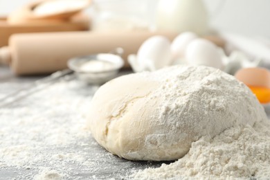 Photo of Wheat dough and products on grey table. Cooking pastries