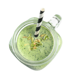 Photo of Mason jar with green buckwheat smoothie isolated on white, top view