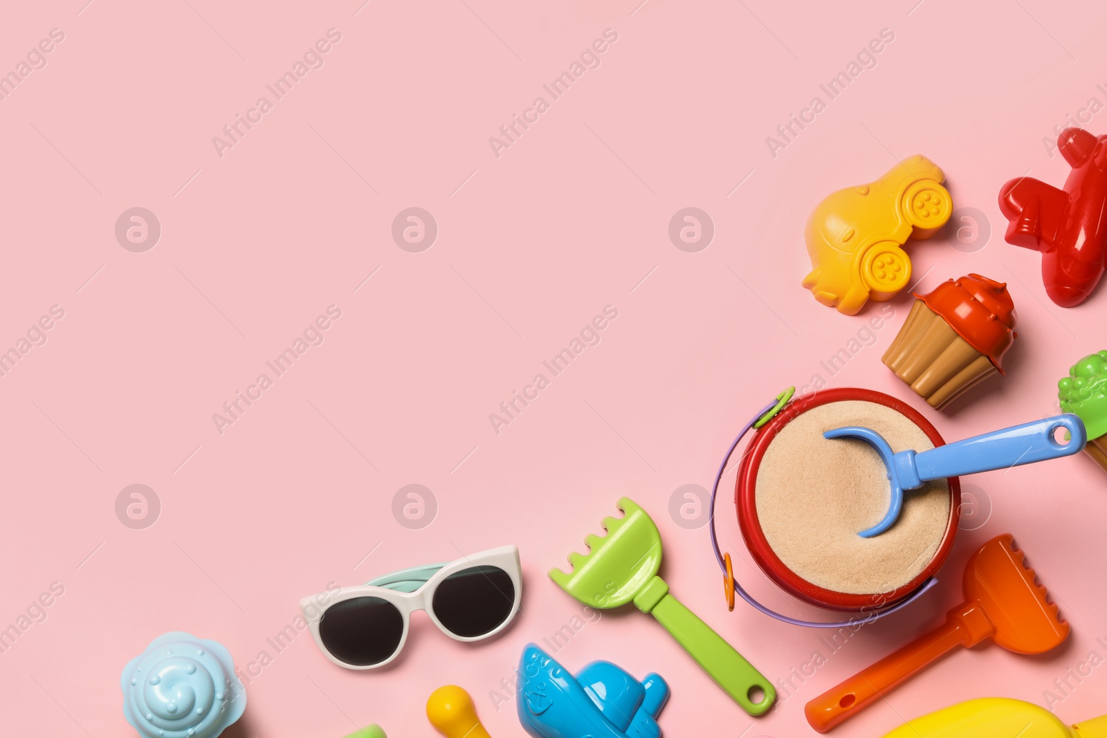 Photo of Flat lay composition with beach toys on color background. Space for text