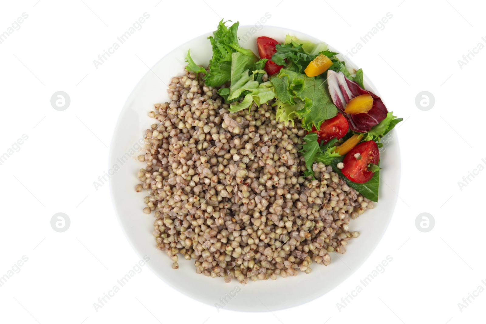 Photo of Tasty buckwheat porridge with vegetables isolated on white, top view