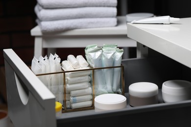 Photo of Storage of different feminine and personal care products in drawer indoors