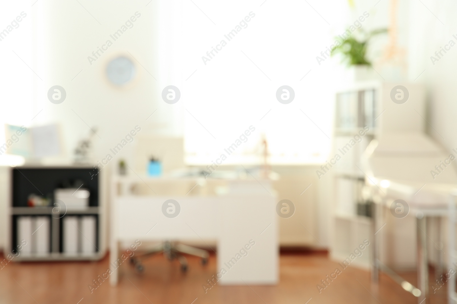 Photo of Blurred view of modern medical office. Doctor's workplace