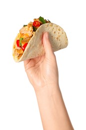 Photo of Woman holding delicious taco with meat and vegetables on white background, closeup