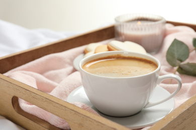 Aromatic coffee on wooden tray. Tasty breakfast