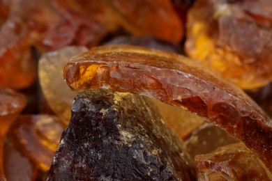 Photo of Pieces of amber as background, closeup view