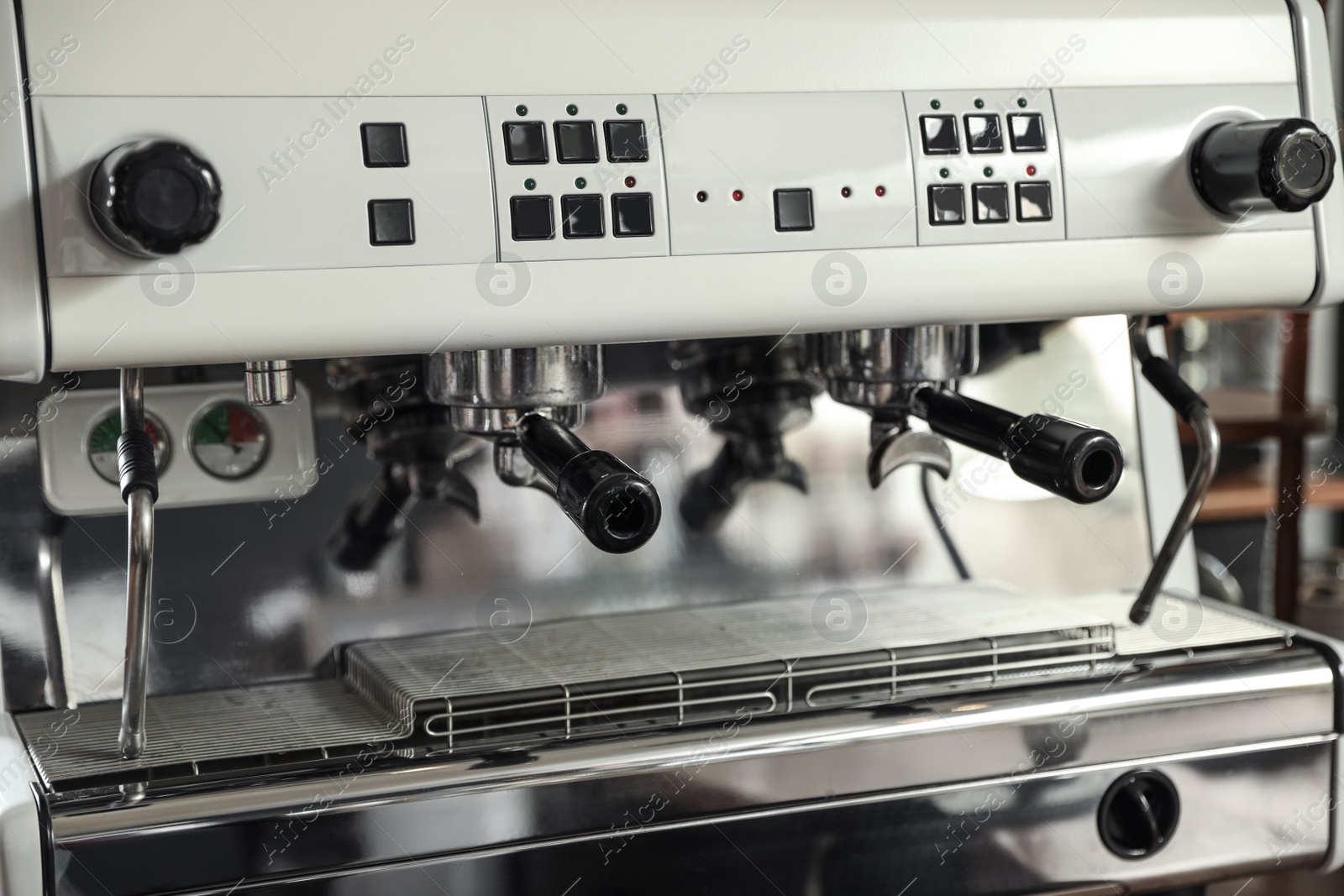 Photo of Modern coffee machine with portafilters, closeup view