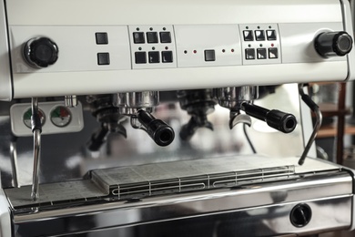 Photo of Modern coffee machine with portafilters, closeup view