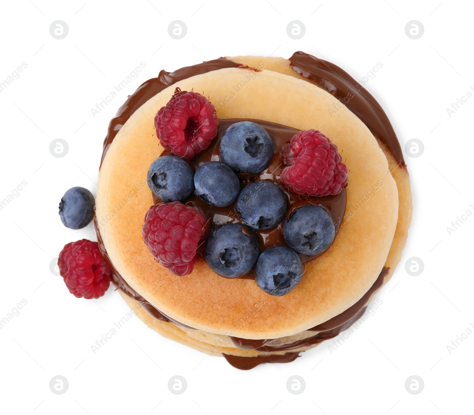 Photo of Tasty pancakes with chocolate spread and berries isolated on white, top view