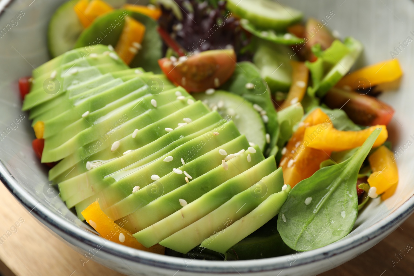 Photo of Healthy dish high in vegetable fats in bowl on table, closeup