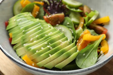Photo of Healthy dish high in vegetable fats in bowl on table, closeup