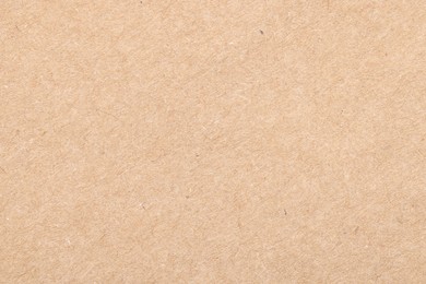 Photo of Texture of beige paper sheet as background, top view