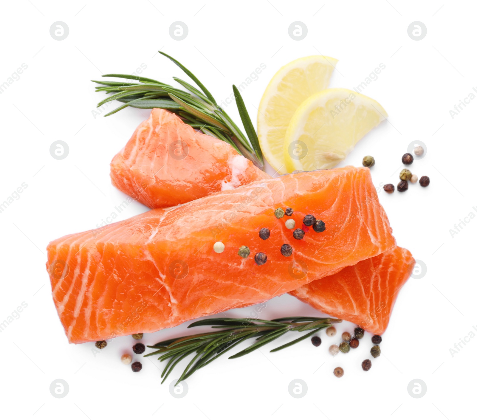 Photo of Pieces of fresh raw salmon, spices and lemon slices isolated on white, top view