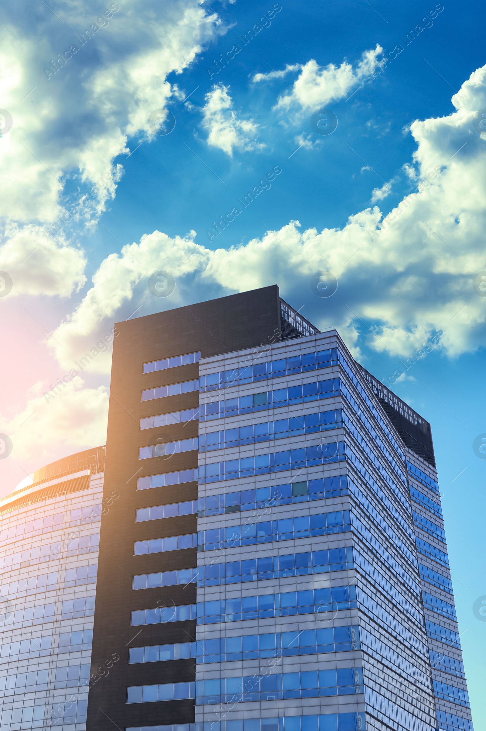 Photo of Low angle view of modern building on sunny day