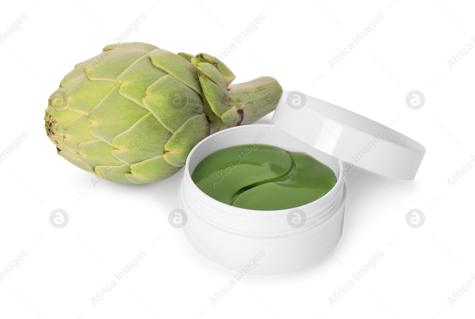 Photo of Package of under eye patches and artichoke on white background. Cosmetic product