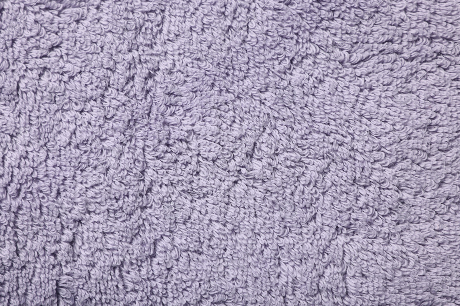 Photo of Texture of soft violet fabric as background, top view