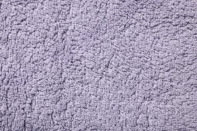 Photo of Texture of soft violet fabric as background, top view