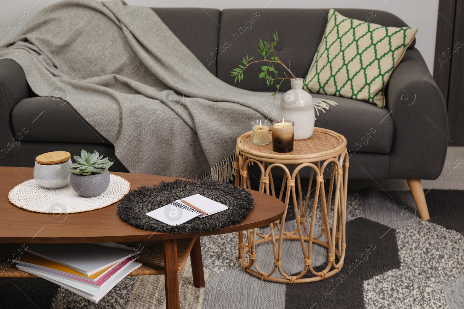 Photo of Living room interior with comfortable sofa and tables